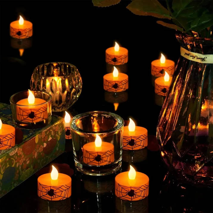 Halloween Flamel Votive Candles Battery Operated with 6H Timer 12 Pack Spider Cobweb Decal LED Flickering Pumpkin Tea Lights Ca